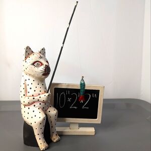 KA signed wood/papier meche folk art tribal stylized cat caught a‎ fish figure